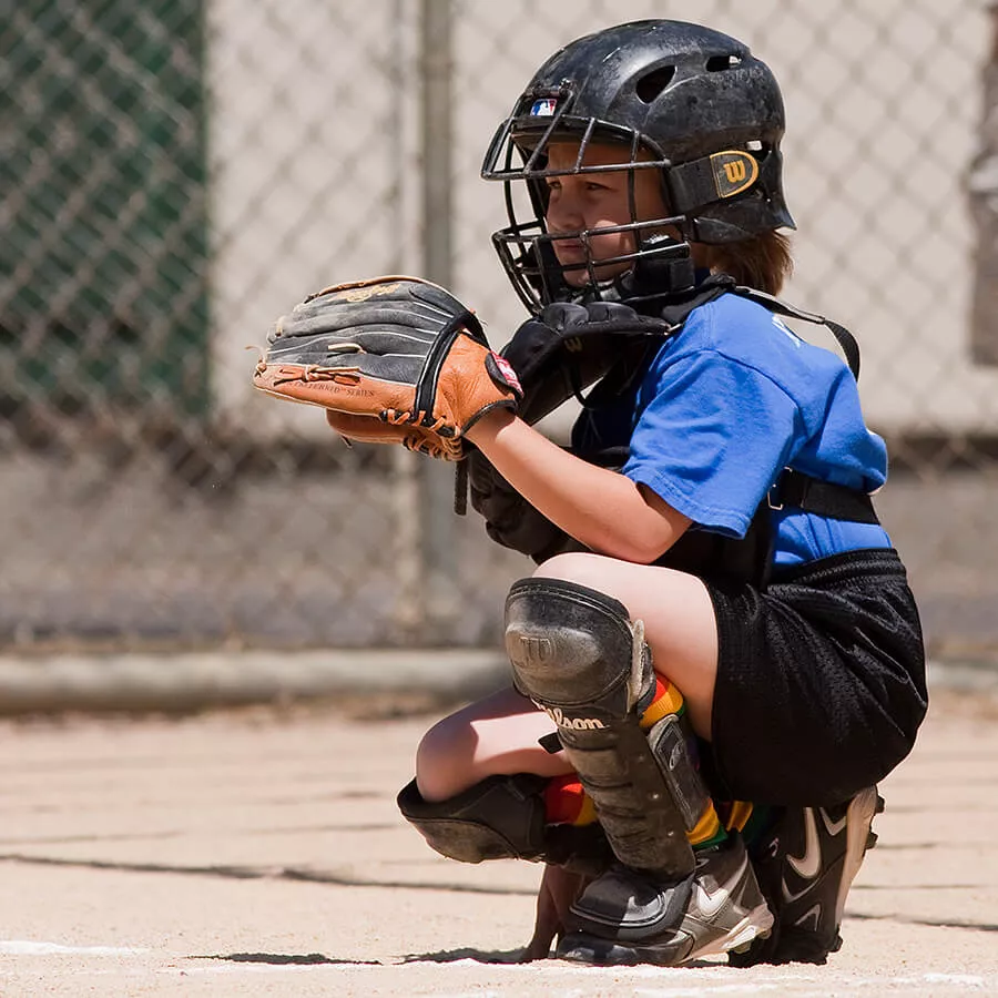 Photo of child playing baseball