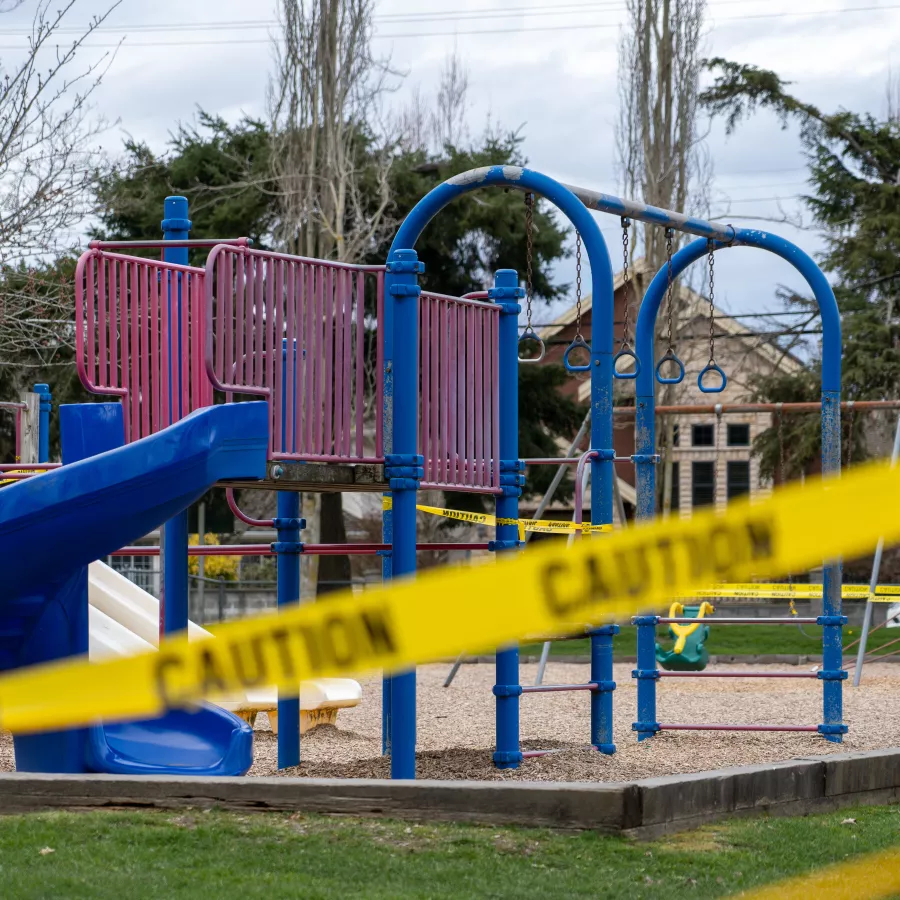 Playground with "Caution" tape